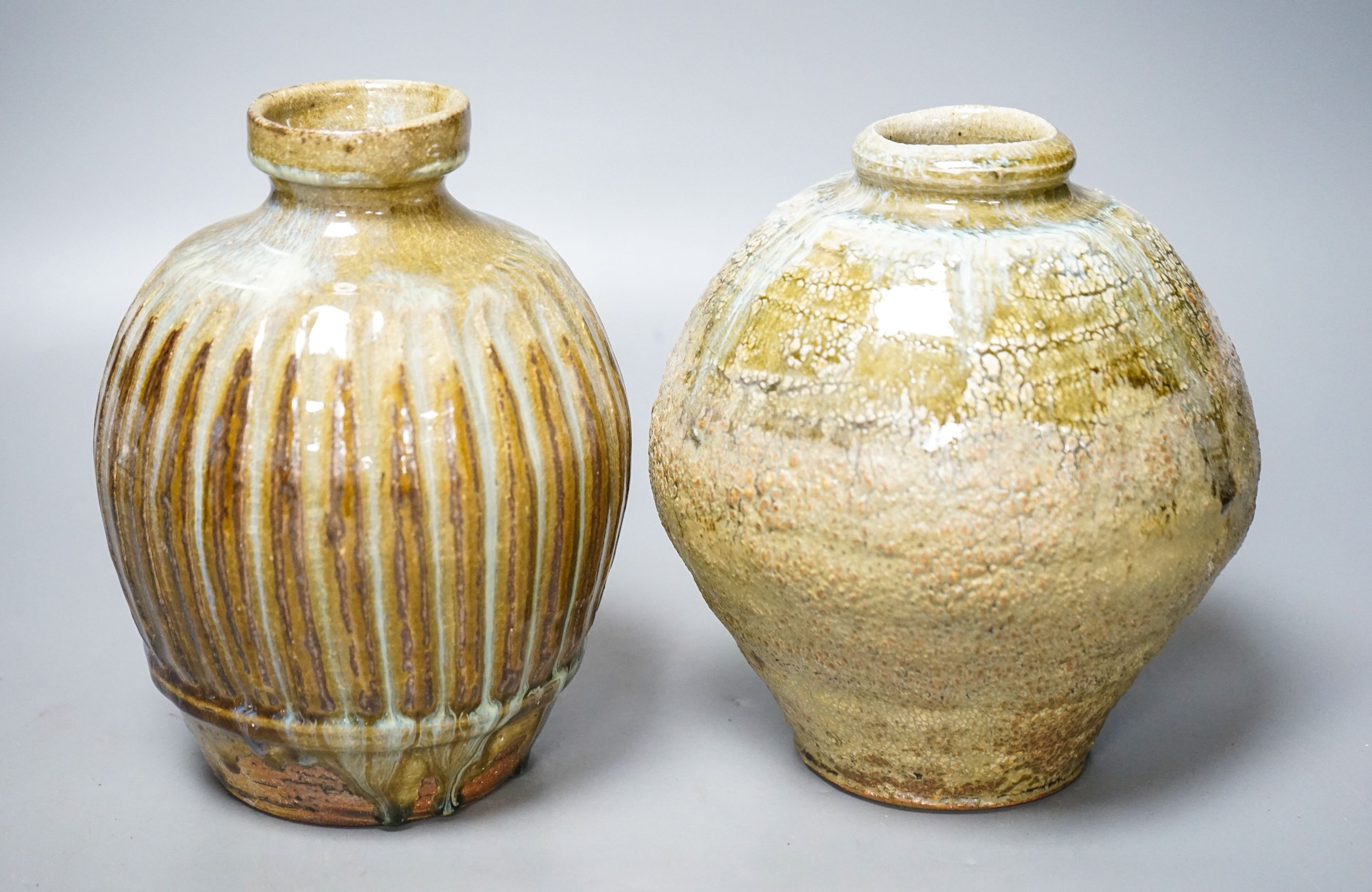 Mike Dodd (b.1943), a fluted globular stoneware vase and an ash glazed globular vase, tallest 18cm (2)